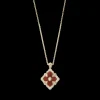 Buccellati OPERA TULLE GOLD PENDANT WITH RED ENAMEL BACKGROUND