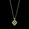 Buccellati OPERA TULLE YELLOW GOLD PENDANT WITH GREEN ENAMEL BACKGROUND