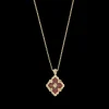Buccellati OPERA TULLE YELLOW GOLD PENDANT WITH RED ENAMEL BACKGROUND